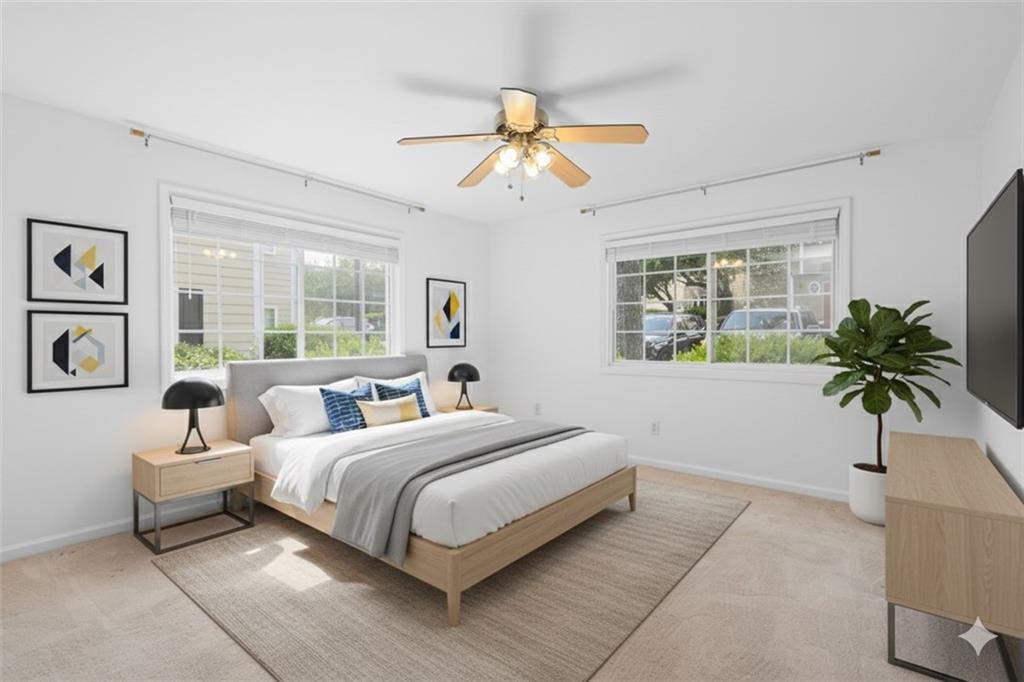 1468 Briarwood Road Northeast, Unit 602 Atlanta, GA 30319 - Photo 20 of 30 a bedroom with a bed and a chandelier