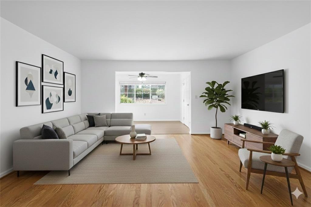 1468 Briarwood Road Northeast, Unit 602 Atlanta, GA 30319 - Photo 2 of 30 a living room with furniture and a flat screen tv