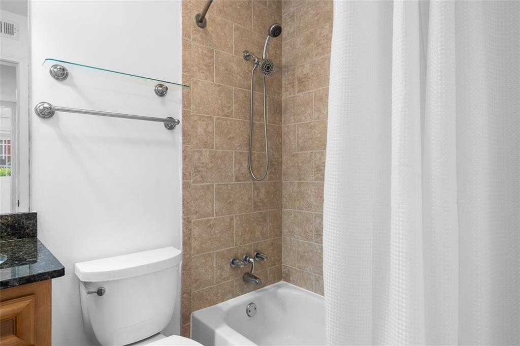 1468 Briarwood Road Northeast, Unit 602 Atlanta, GA 30319 - Photo 26 of 30 a bathroom with a shower and a toilet