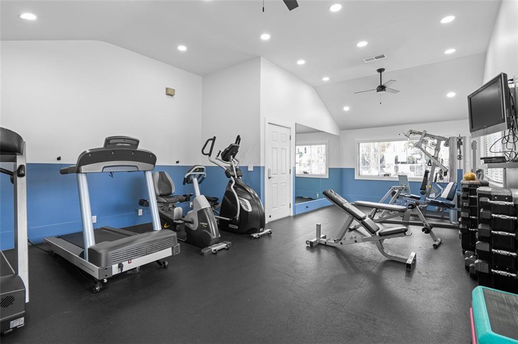 1468 Briarwood Road Northeast, Unit 602 Atlanta, GA 30319 - Photo 30 of 30 a room with gym equipment and a view of living room