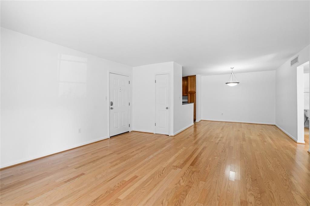 1468 Briarwood Road Northeast, Unit 602 Atlanta, GA 30319 - Photo 9 of 30 a view of empty room with wooden floor