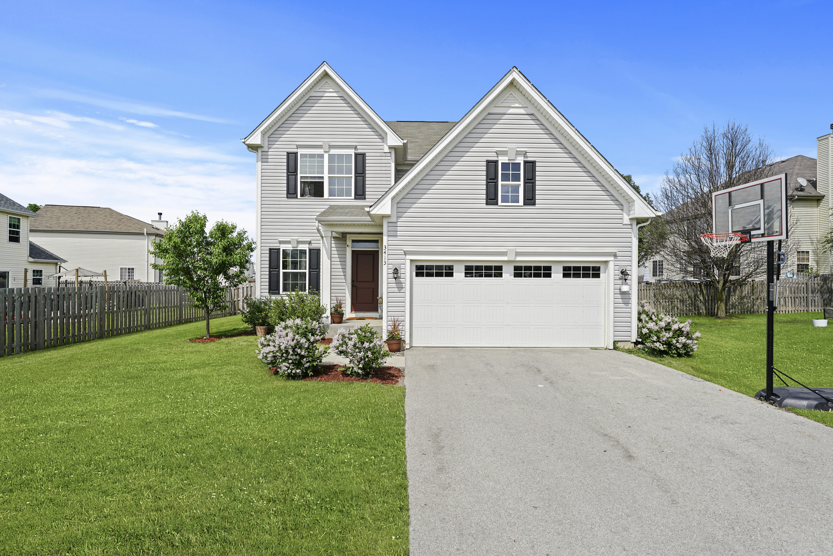 a view of a house with garden and yard