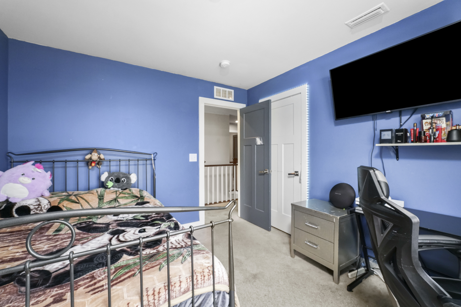 3413 Forestview Drive Joliet, IL 60431 - Photo 17 of 32 a bedroom with a bed and a flat screen tv