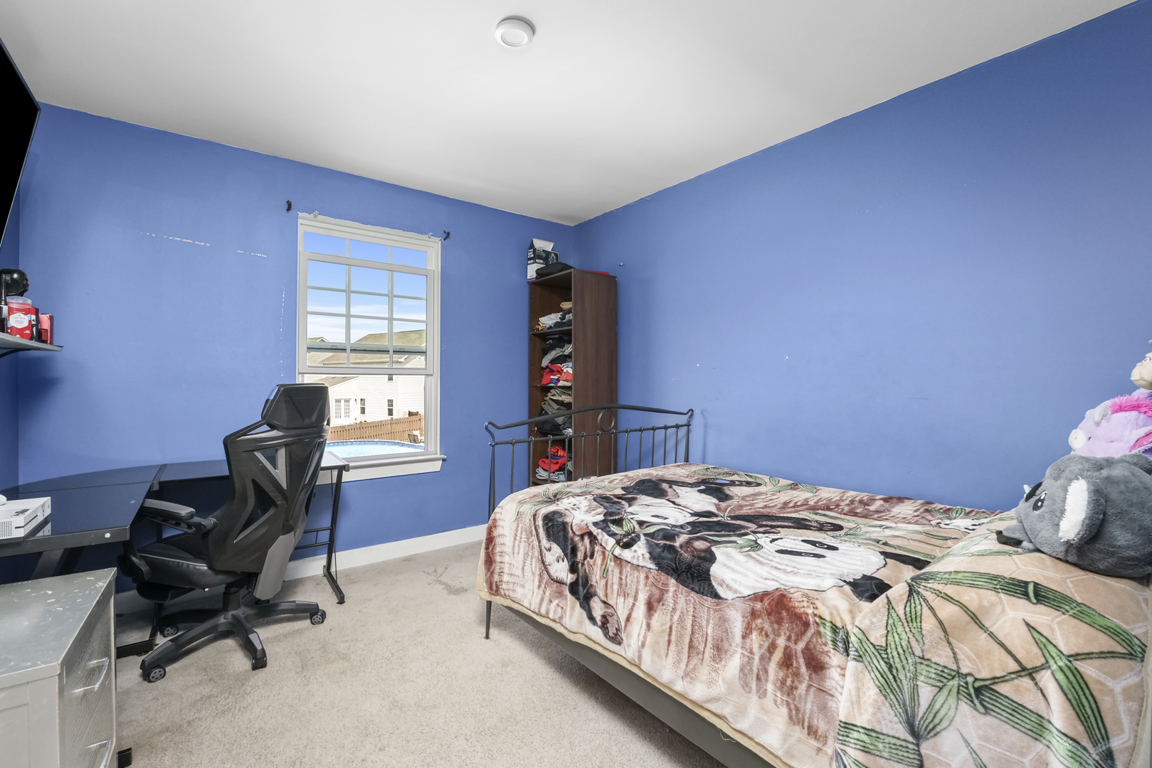 3413 Forestview Drive Joliet, IL 60431 - Photo 18 of 32 a bedroom with a bed and a chair