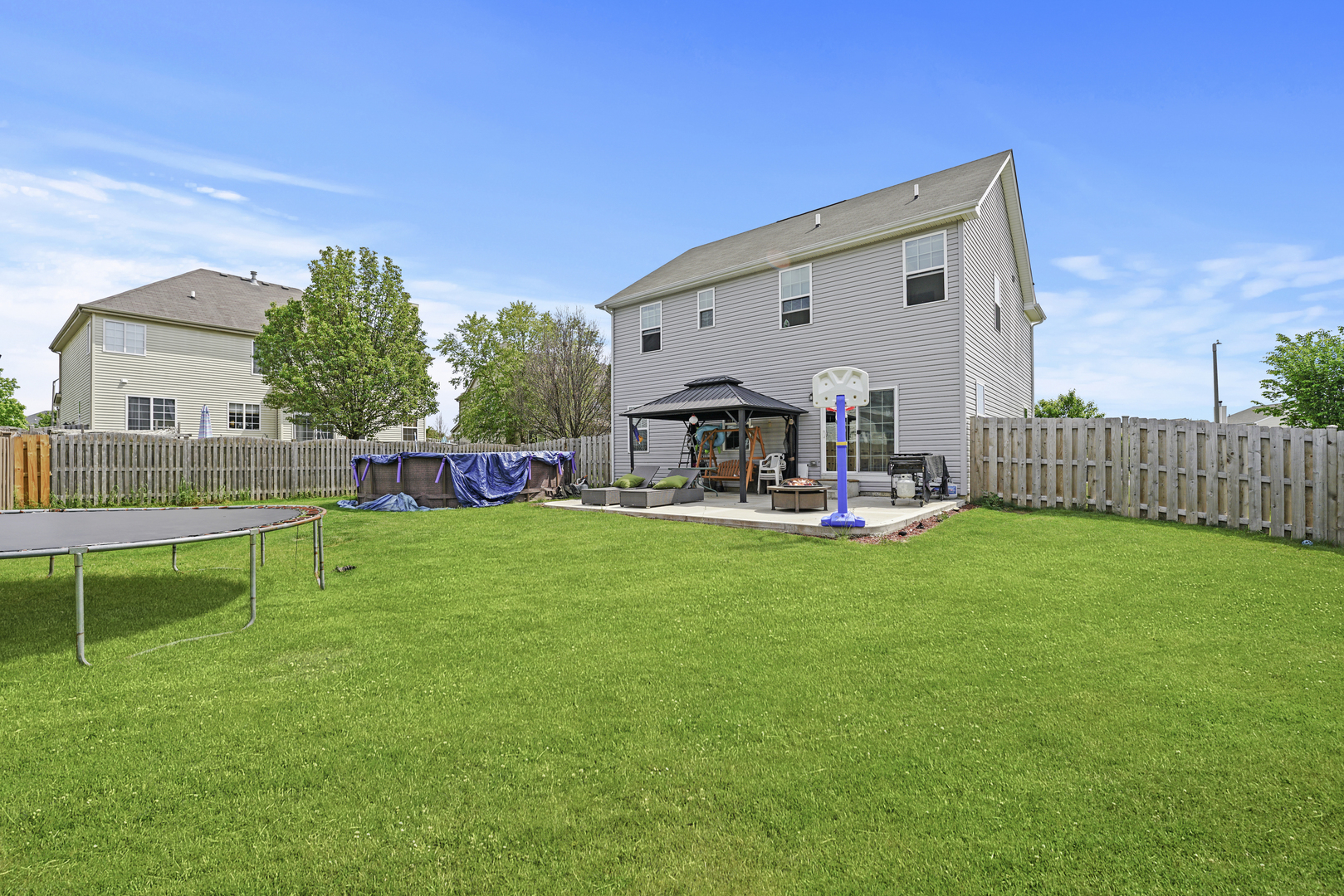 3413 Forestview Drive Joliet, IL 60431 - Photo 27 of 32 a view of a house with backyard and a slide