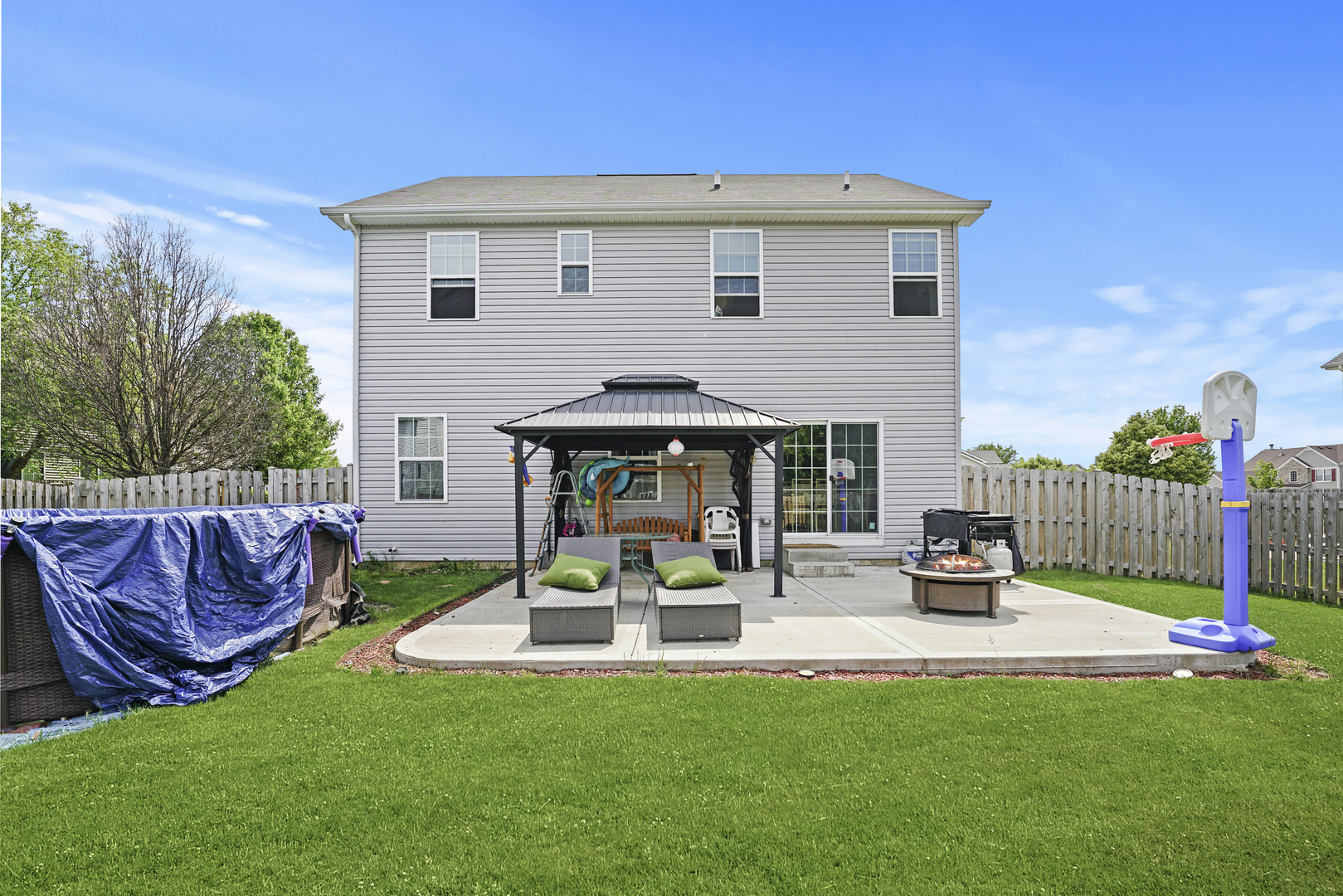 3413 Forestview Drive Joliet, IL 60431 - Photo 28 of 32 a view of a patio with couches chairs and a fire pit with an outdoor seating