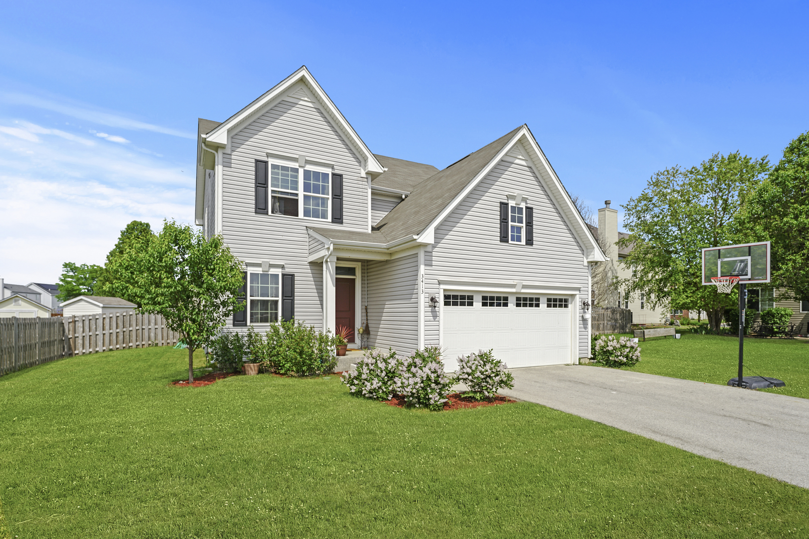 3413 Forestview Drive Joliet, IL 60431 - Photo 29 of 32 a front view of a house with a yard and garage