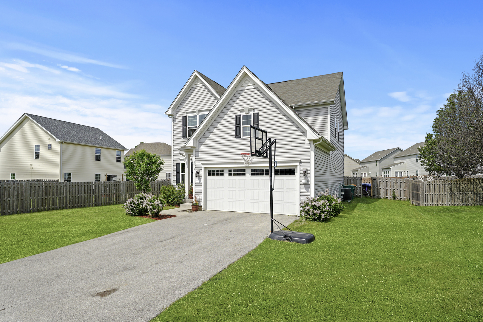3413 Forestview Drive Joliet, IL 60431 - Photo 30 of 32 a front view of a house with a yard and garage