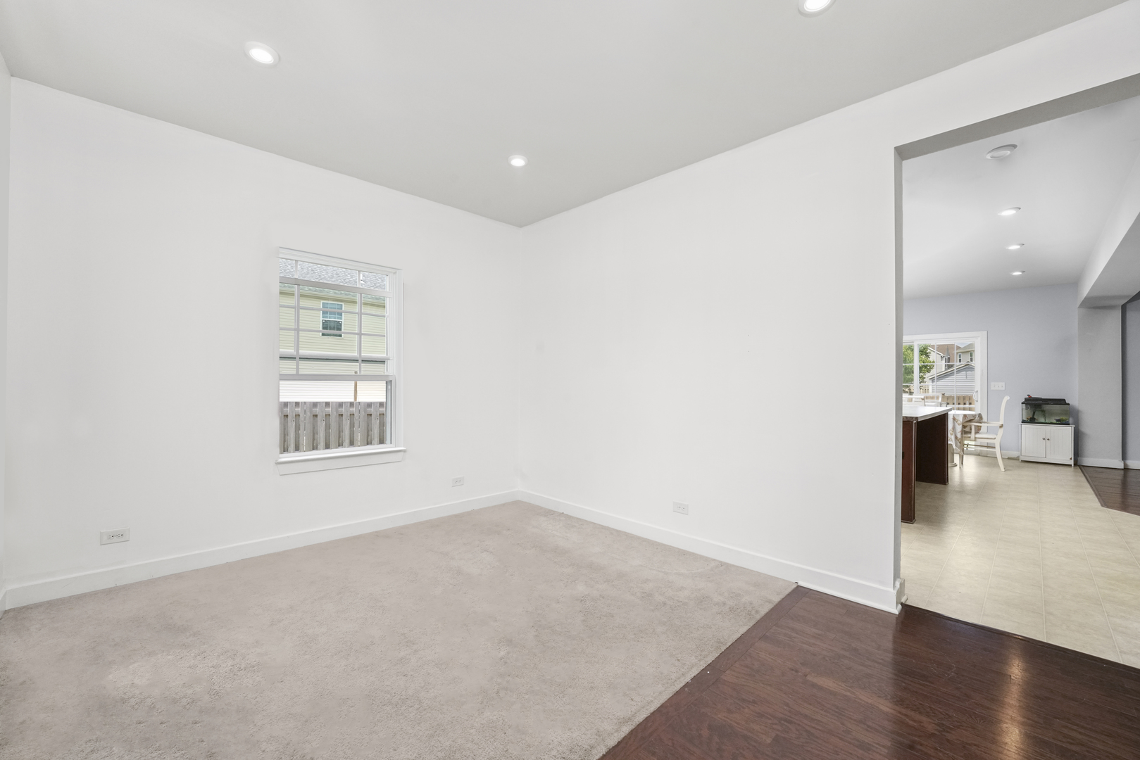 3413 Forestview Drive Joliet, IL 60431 - Photo 3 of 32 an empty room with wooden floor and a window