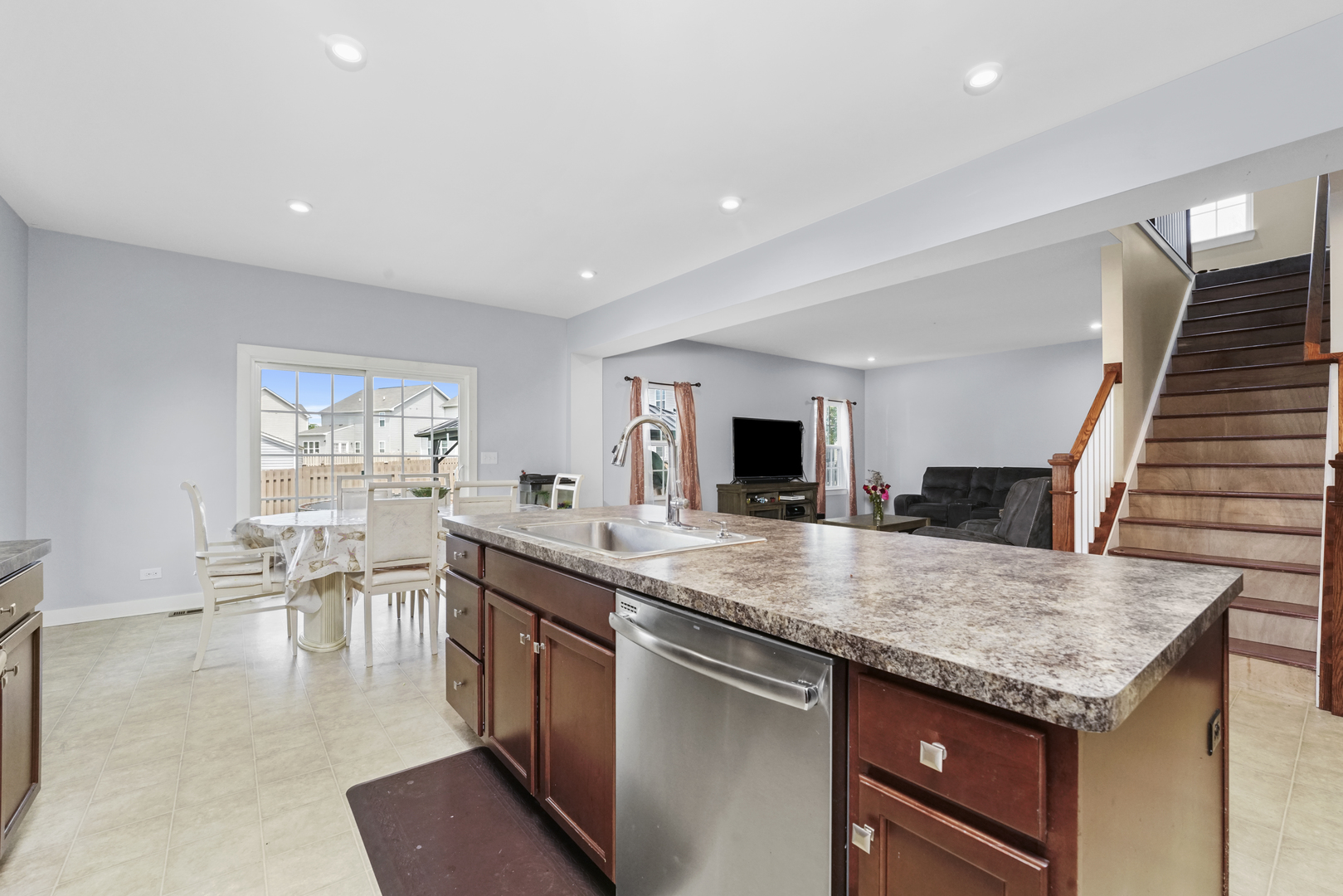 3413 Forestview Drive Joliet, IL 60431 - Photo 7 of 32 a kitchen with granite countertop a stove and a sink