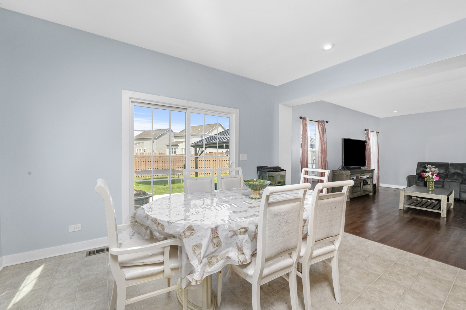 3413 Forestview Drive Joliet, IL 60431 - Photo 8 of 32 a view of a dining room with furniture window and wooden floor