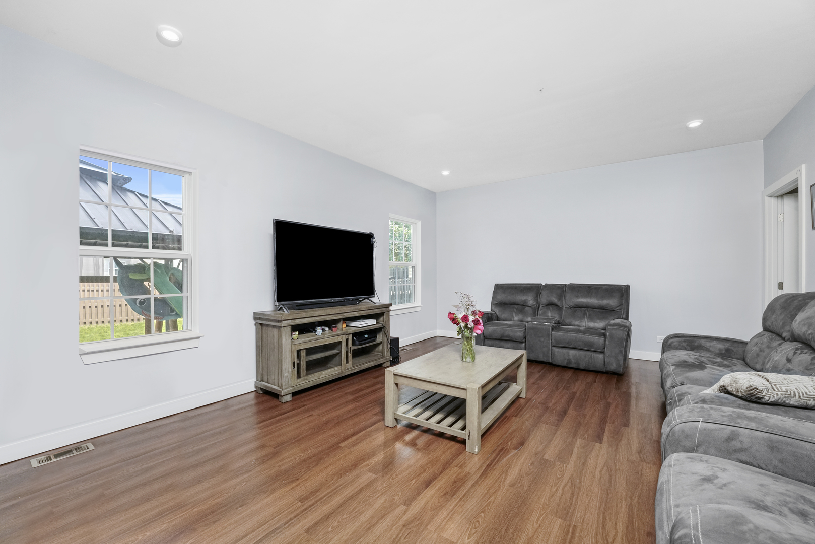 3413 Forestview Drive Joliet, IL 60431 - Photo 9 of 32 a living room with furniture and a flat screen tv
