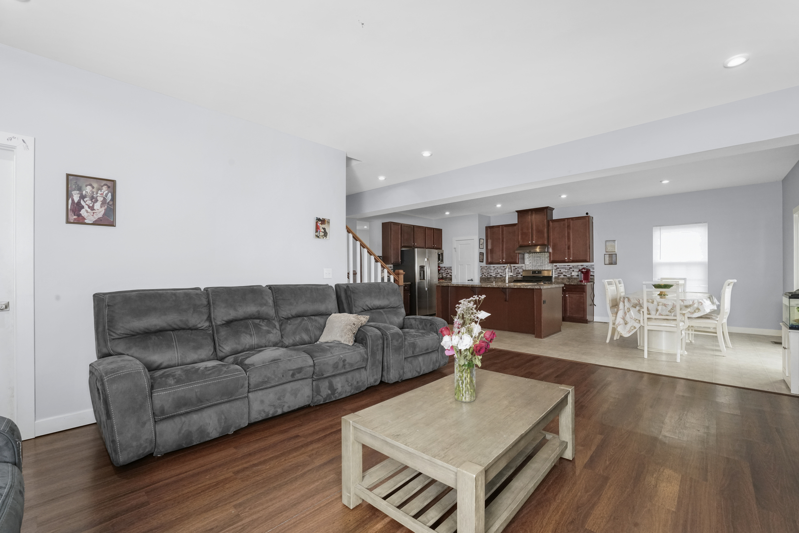 3413 Forestview Drive Joliet, IL 60431 - Photo 10 of 32 a living room with furniture and a wooden floor