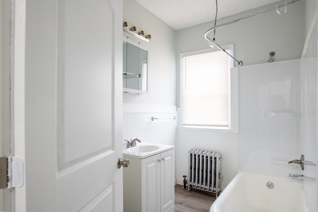 69 Winter Street Springfield, MA 01105 - Photo 11 of 36 a bathroom with a sink a toilet and shower