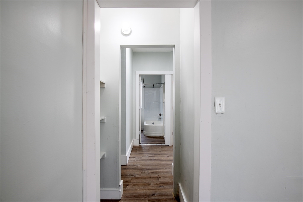 69 Winter Street Springfield, MA 01105 - Photo 22 of 36 a view of a bathroom from a hallway