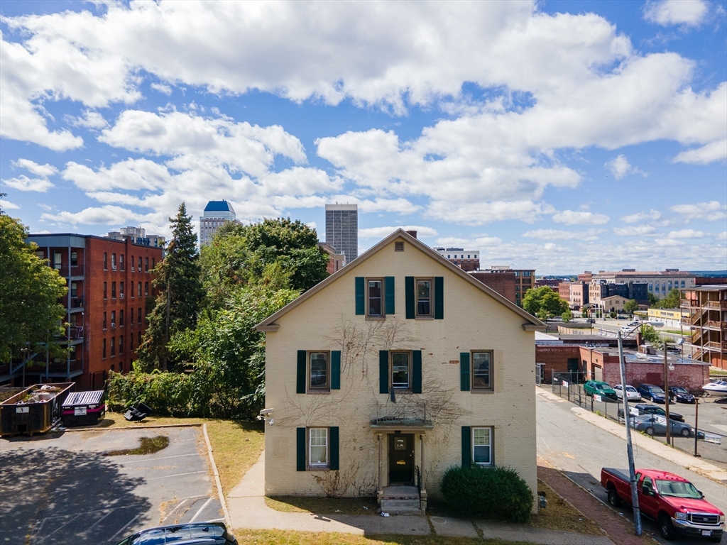 69 Winter Street Springfield, MA 01105 - Photo 3 of 36 a front view of a house with a garden