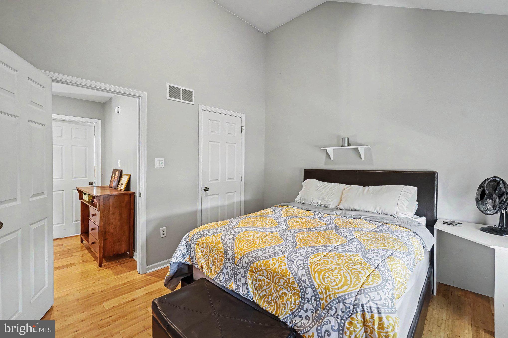64 Open Meadow Court Elkton, MD 21921 - Photo 37 of 57 a bedroom with a bed and wooden floor