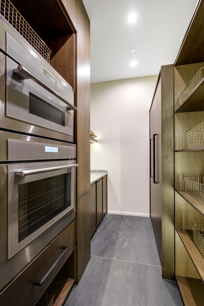 921 Sheridan Road Glencoe, IL 60022 - Photo 11 of 51 a kitchen with granite countertop cabinets and steel stainless steel appliances