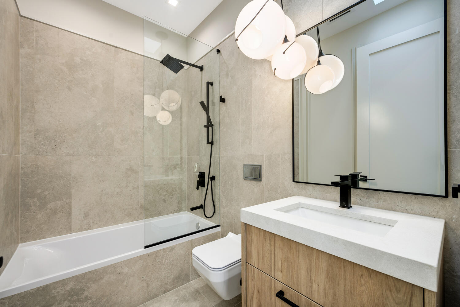 921 Sheridan Road Glencoe, IL 60022 - Photo 31 of 51 a bathroom with a sink a toilet a mirror and shower