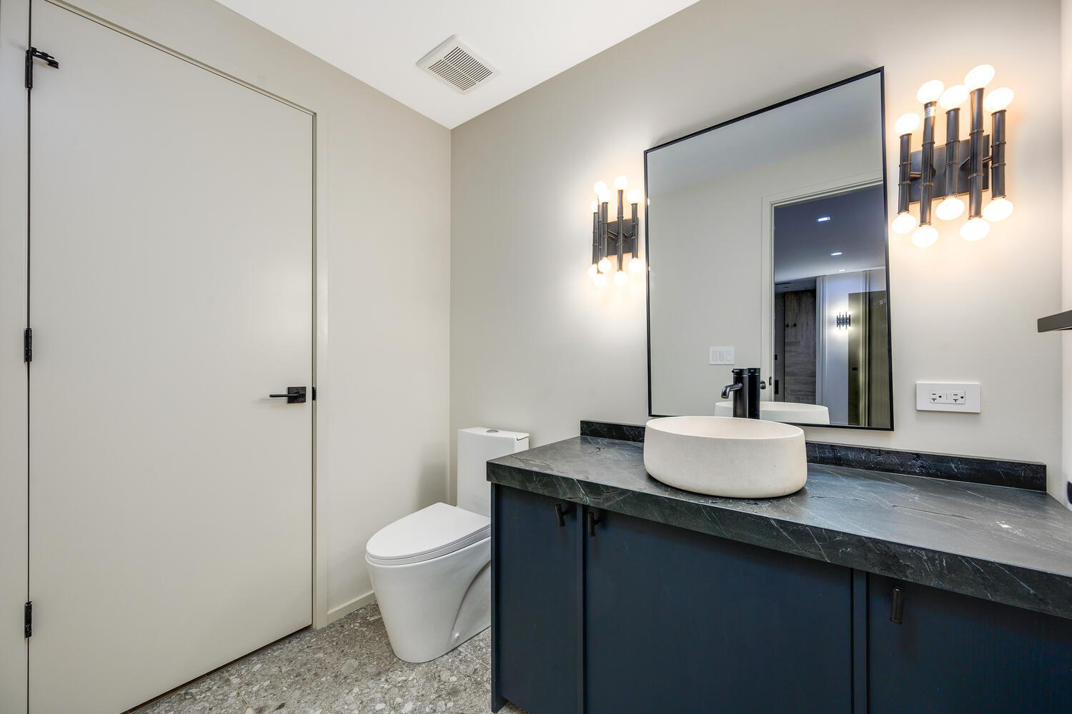 921 Sheridan Road Glencoe, IL 60022 - Photo 36 of 51 a bathroom with a granite countertop sink toilet and mirror