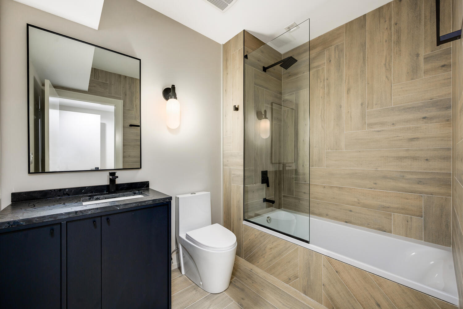 921 Sheridan Road Glencoe, IL 60022 - Photo 40 of 51 a bathroom with a granite countertop sink toilet and shower
