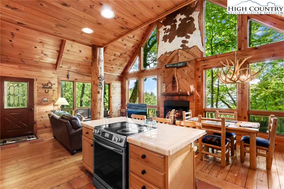 2095 Elk Ridge Road Ferguson, NC 28624 - Photo 11 of 47 a view of a dining room with furniture window and outside view