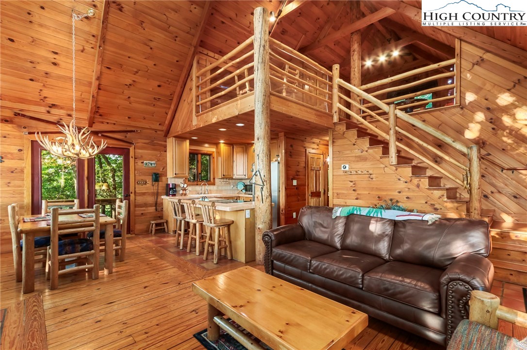 2095 Elk Ridge Road Ferguson, NC 28624 - Photo 12 of 47 a roof deck with a table and chairs