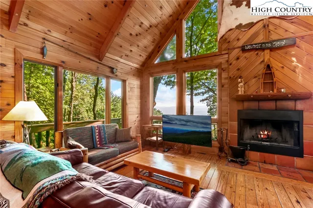 a bedroom with furniture window and wooden floor