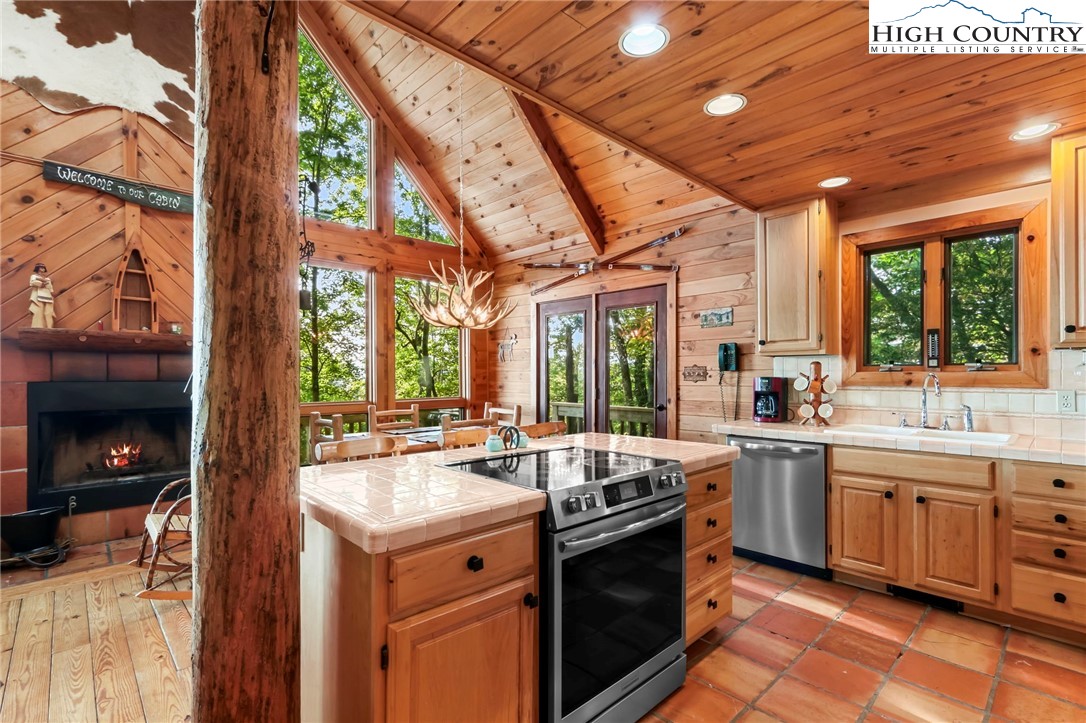 2095 Elk Ridge Road Ferguson, NC 28624 - Photo 15 of 47 a kitchen with sink stove and cabinets