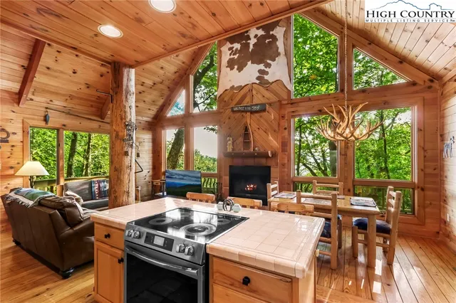 a bedroom with a bed and a view of the house