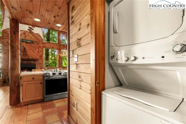 a view of balcony with wooden floor and fence