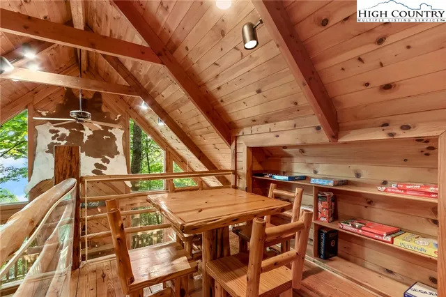 a view of a street with a building and trees in the background