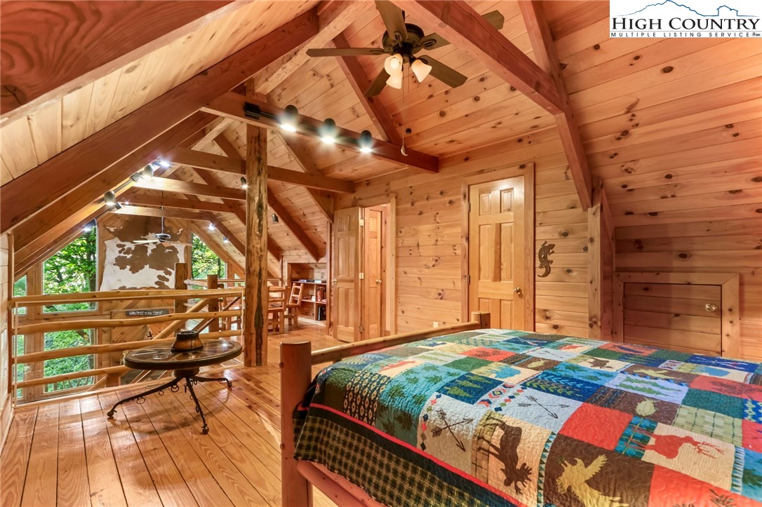 2095 Elk Ridge Road Ferguson, NC 28624 - Photo 25 of 47 a bed sitting in a bedroom next to a window