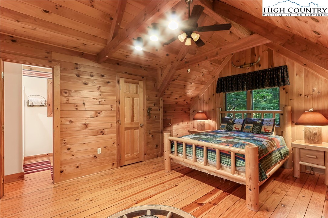 2095 Elk Ridge Road Ferguson, NC 28624 - Photo 27 of 47 a bedroom with a bed and a view of the house