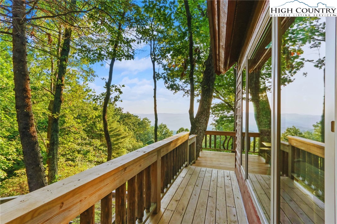 2095 Elk Ridge Road Ferguson, NC 28624 - Photo 35 of 47 a view of balcony with wooden floor and fence