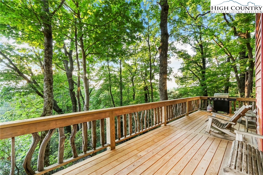 2095 Elk Ridge Road Ferguson, NC 28624 - Photo 36 of 47 a view of balcony with deck and wooden floor
