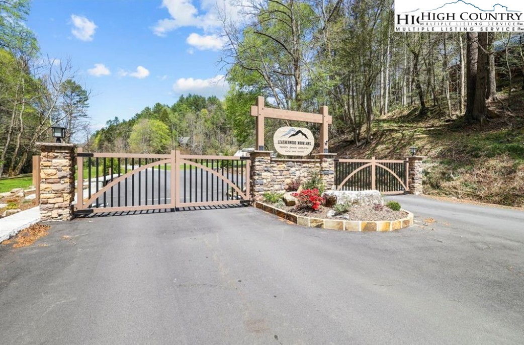 2095 Elk Ridge Road Ferguson, NC 28624 - Photo 44 of 47 a view of a street with a building and trees in the background