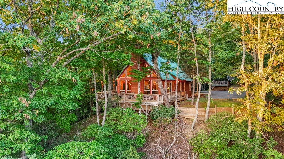 2095 Elk Ridge Road Ferguson, NC 28624 - Photo 47 of 47 an aerial view of residential house with outdoor space and trees