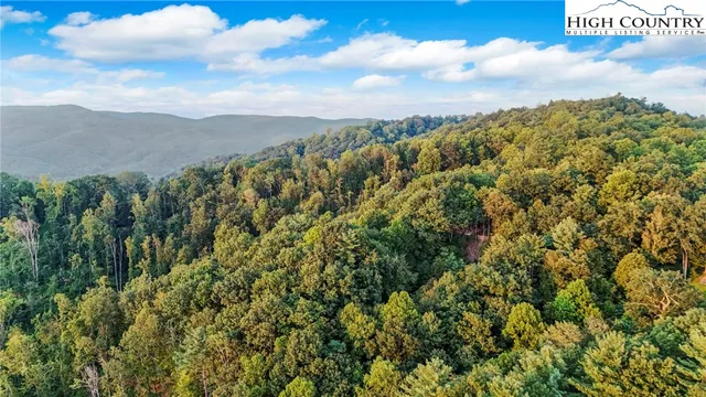 a roof deck with a table and chairs