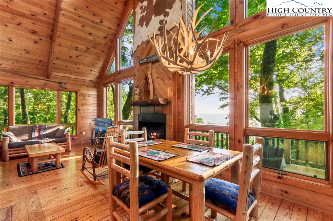 2095 Elk Ridge Road Ferguson, NC 28624 - Photo 6 of 47 a view of a patio with a table chairs and a fire pit