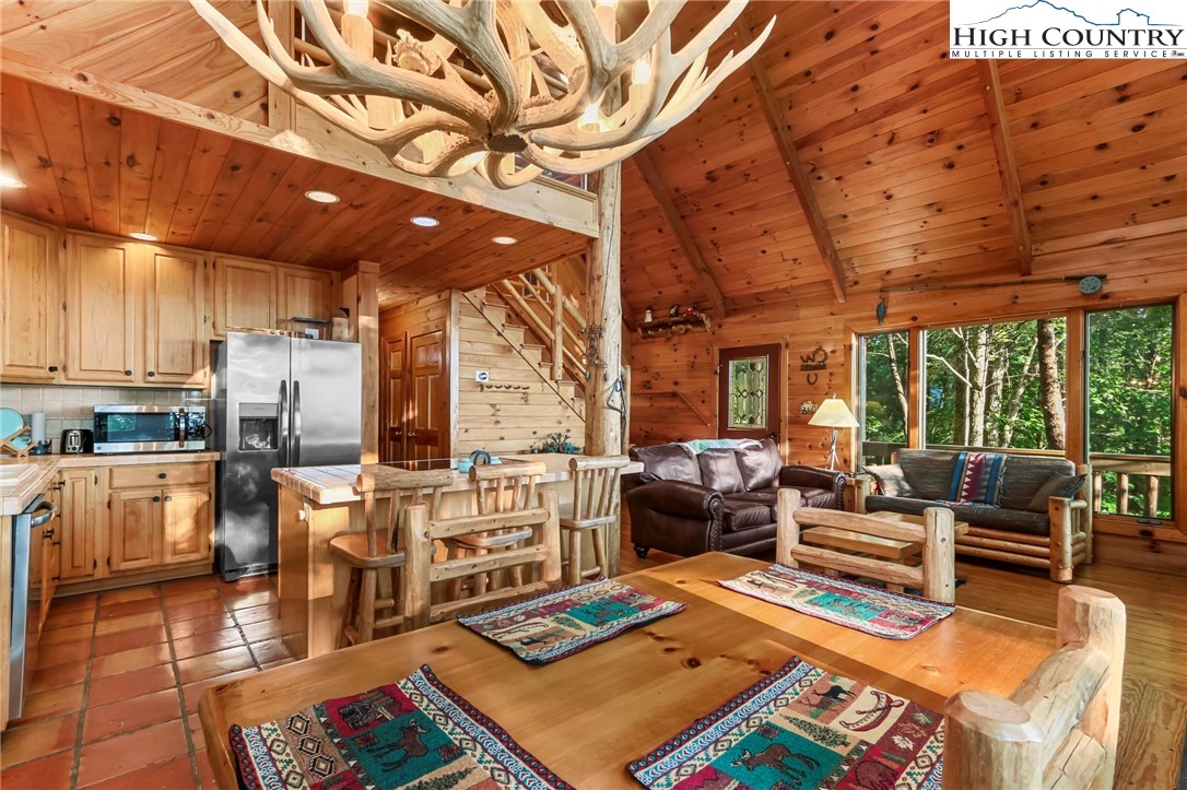 2095 Elk Ridge Road Ferguson, NC 28624 - Photo 7 of 47 a living room with lots of furniture and kitchen view