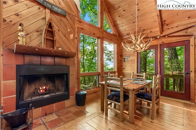 a bed room with a bed and a chandelier