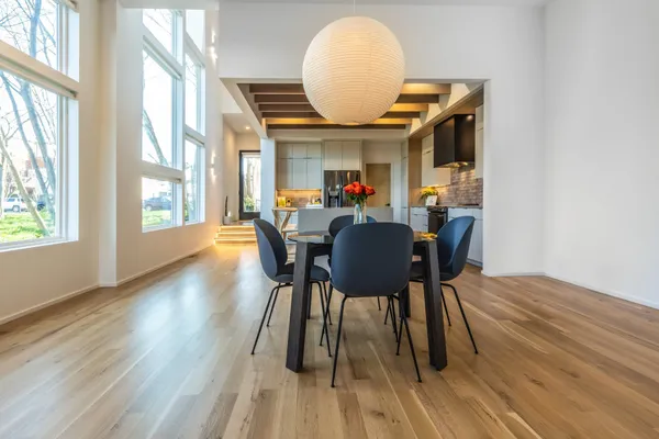 a view of a dining room with furniture window and wooden floor