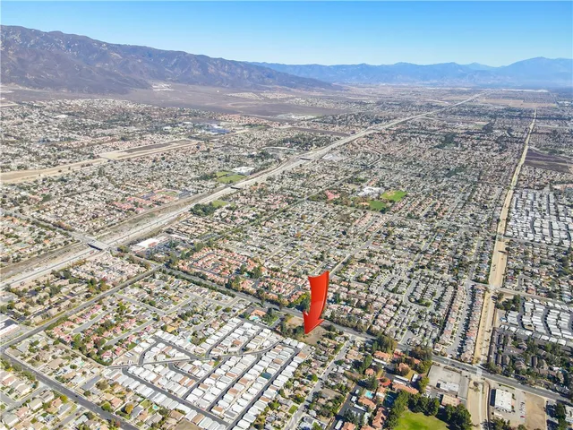 an aerial view of a houses with yard