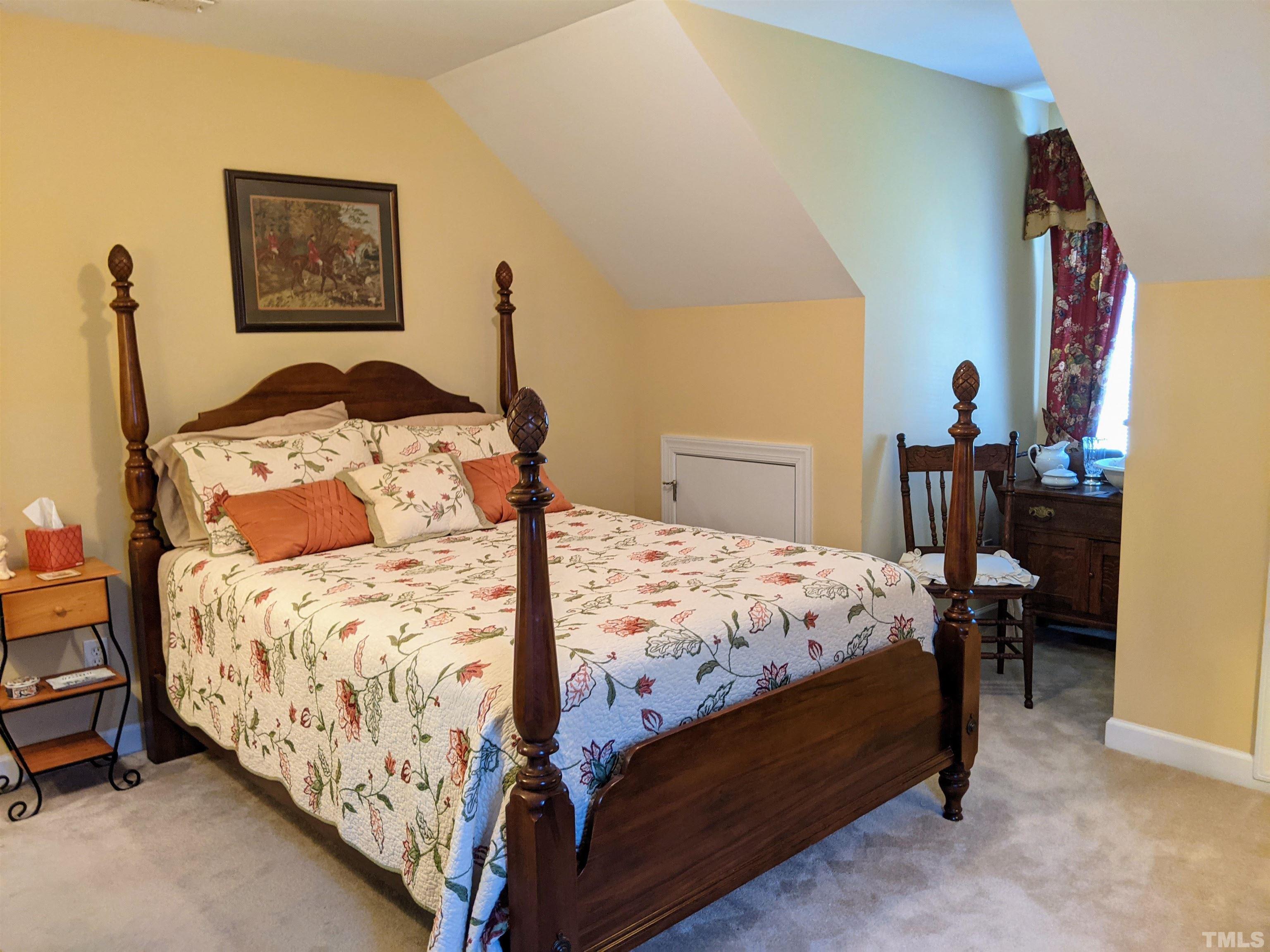 5901 Whatsit Lane Raleigh, NC 27603 - Photo 22 of 30 a bedroom with bed and a window