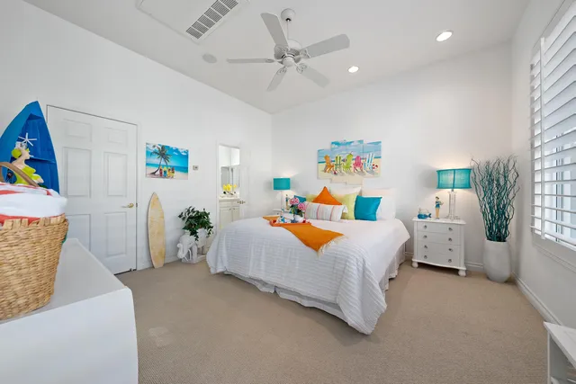 a bedroom with furniture and a flat screen tv