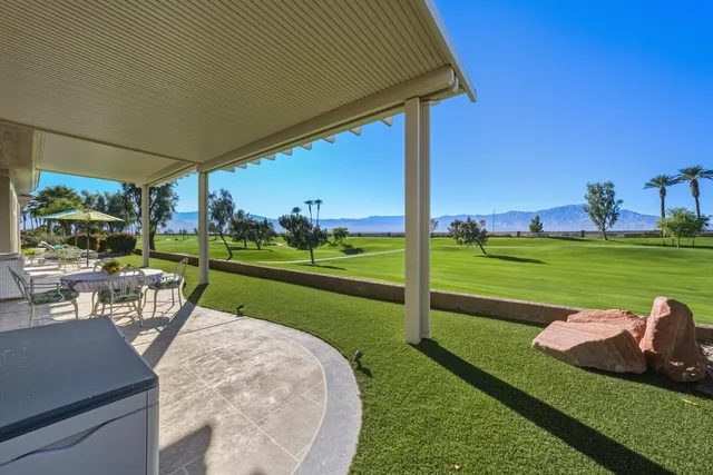 a view of a golf course with a big yard