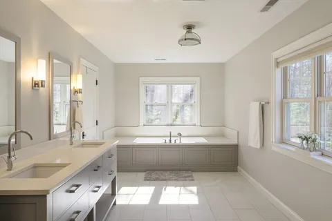 a bedroom with furniture and window