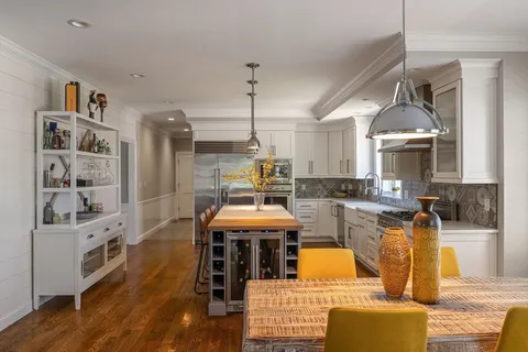 a living room with furniture fireplace and a flat screen tv