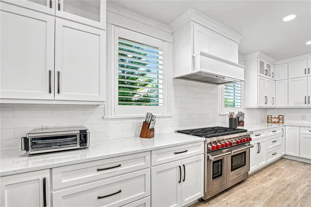 a view of two chairs in the balcony
